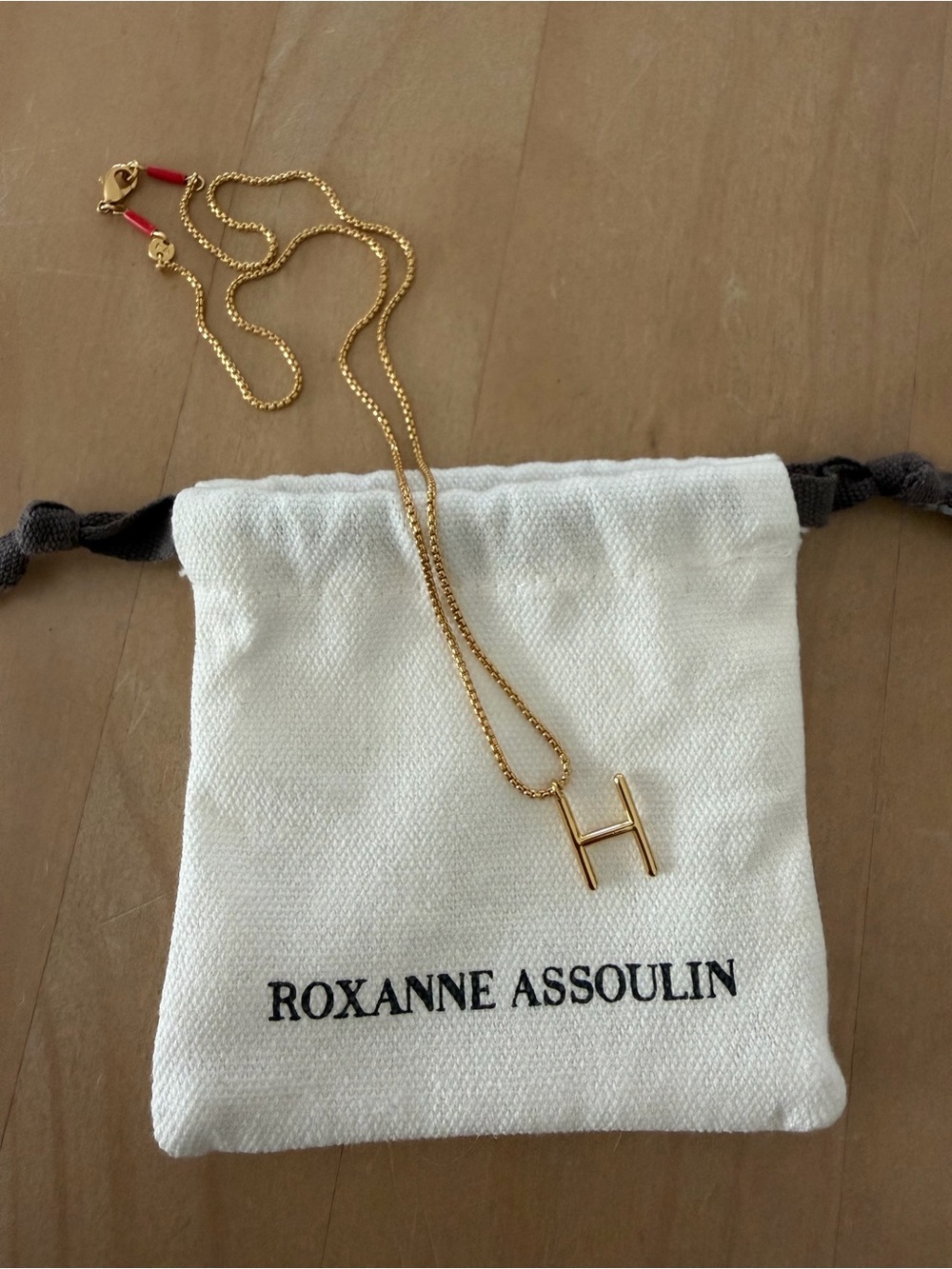 Roxanne Assoulin 17” dainty initial necklace letter H. NWOT. Comes w/dust bag.